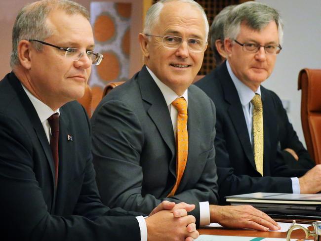 PM Malcolm Turnbull, flanked by Treasurer Scott Morrison and PM &amp; C Secretary Dr Martin Parkinson, addresses State and Territory leaders, Treasurers and staff in the Cabinet Room of Parliament House, Canberra, at the start of the COAG meeting.