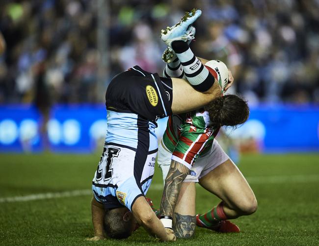 Wade Graham (left) upended while tackling Ethan Lowe.