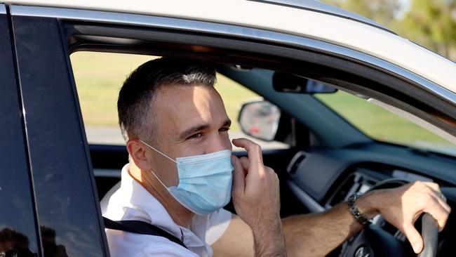 South Australian opposition leader Peter Malinauskas drives through the Victoria Park testing clinic. Picture: Kelly Barnes