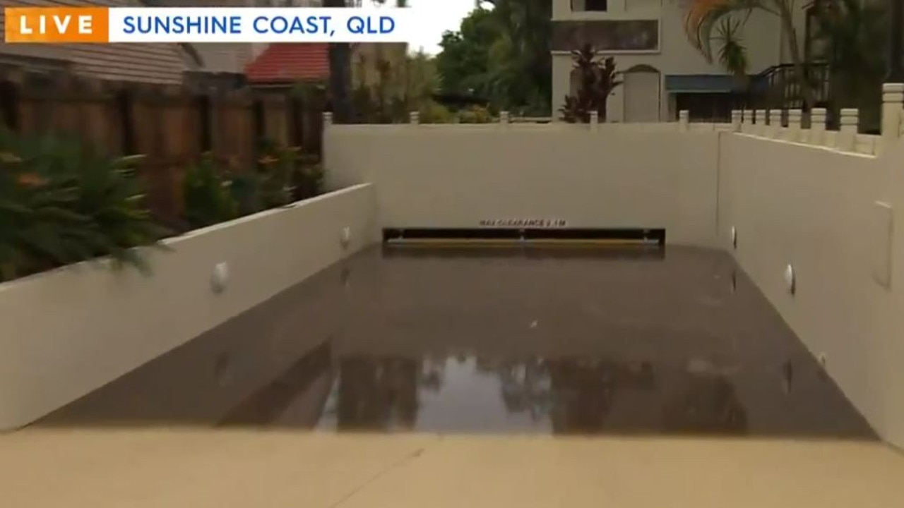 Cars were trapped in this Coolum apartment complex car park after it was flooded. Image: Today, Channel 9