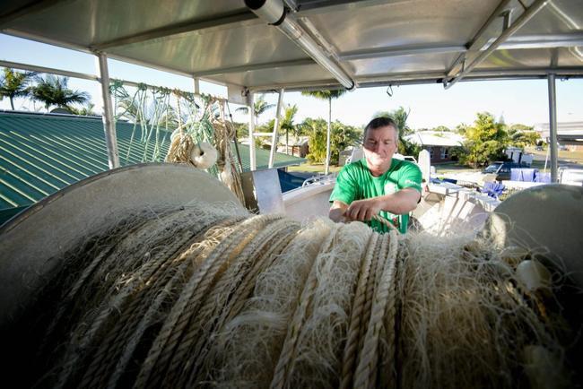 Tannum Sands commercial fisherman Dane King is fighting a losing battle trying to keep his nets in the water. Picture: Paul Braven