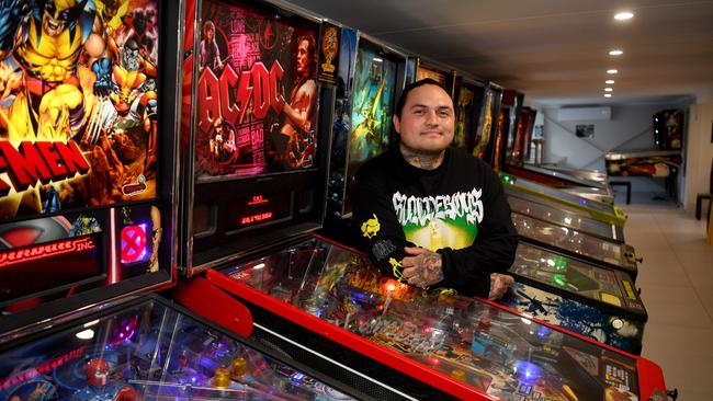 Jason Lynch in the 'Pinball Holiday House' in Belgian Gardens, Townsville. Picture: Evan Morgan