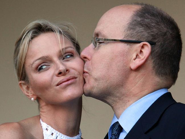 Prince Albert of Monaco kisses his new bride, Princess Charlene on July 6, 2011. Picture: AFP / Rajesh Jantilal