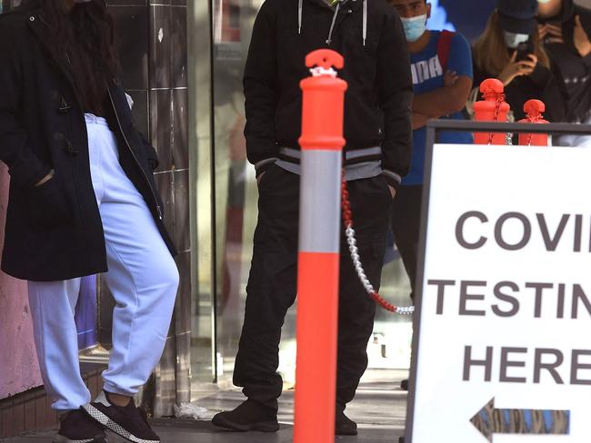 People queue up for Covid-19 testing in Melbourne on May 12, 2021, after a man tested positive to Covid-19 in the first community case in the city for two months. (Photo by William WEST / AFP)