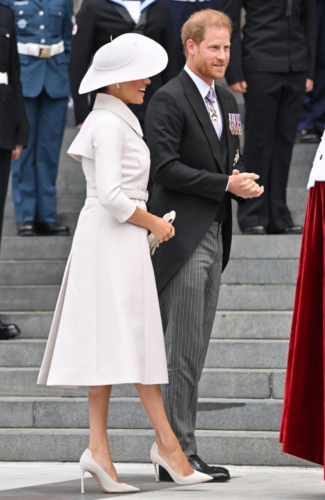 Meghan Markle looking stunning in an all-white outfit with matching hat at the National Service of Thanksgiving. Picture: Samir Hussein/WireImage