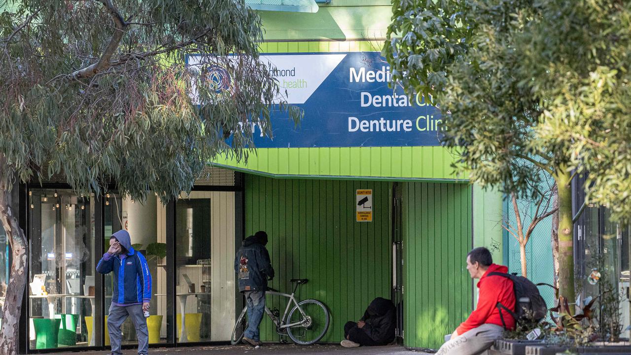 People appear to inject drugs in the streets after collecting needles from the safe injecting room in Richmond. Picture: Jason Edwards