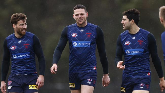 MELBOURNE, AUSTRALIA - JUNE 10: Steven May of the Demons (C) shares a laugh with Jack Viney (L) and Christian Petracca (2R) during a Melbourne Demons AFL training session at Casey Fields on June 10, 2022 in Melbourne, Australia. (Photo by Daniel Pockett/Getty Images)