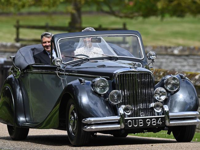 Pippa Middleton arrives with her father Michael Middleton in the vintage Jaguar.