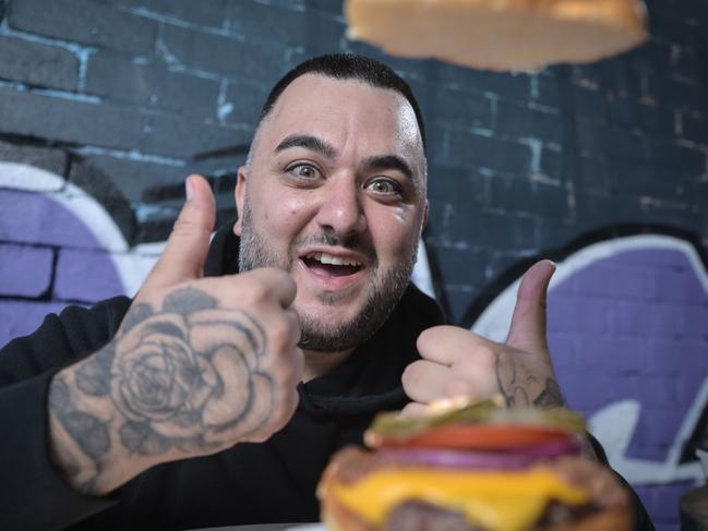 Gee Ozgen, owner of Mister Gee Burger Truck, at his burger bar Happy Endings. Picture: Flavio Brancaleone