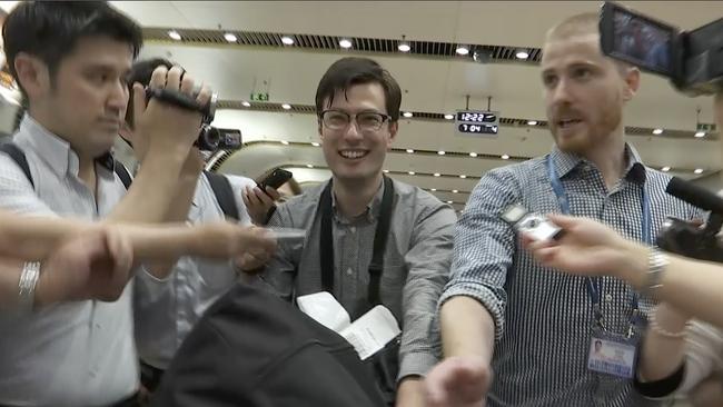 Australian student Alek Sigley gestures as he arrives at the airport in Beijing on Thursday, July 4, 2019. The Australian student who vanished in North Korea more than a week ago arrived in Beijing on Thursday morning (AP Photo/Emily Wang)