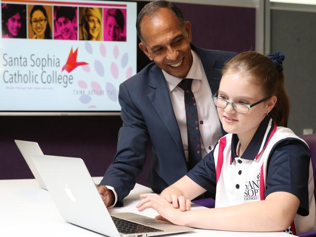 New student Jessica Bollard being shown some lessons by school principal Mark De Vries.