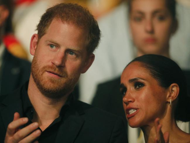 Harry, Duke of Sussex and patron of the Invictus Games (L), and his wife Meghan, Duchess of Sussex, attend the closing ceremony of the 2023 Invictus Games in Duesseldorf, western Germany on September 16, 2023. The Invictus Games, an international sports competition for wounded soldiers founded by British royal Prince Harry in 2014, was taking place from September 9 to 16, 2023 in Duesseldorf. (Photo by LEON KUEGELER / AFP)