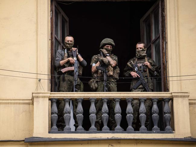 Wagner group fighters stand on the balcony of the circus building in the city of Rostov-on-Don, on June 24. Picture: AFP