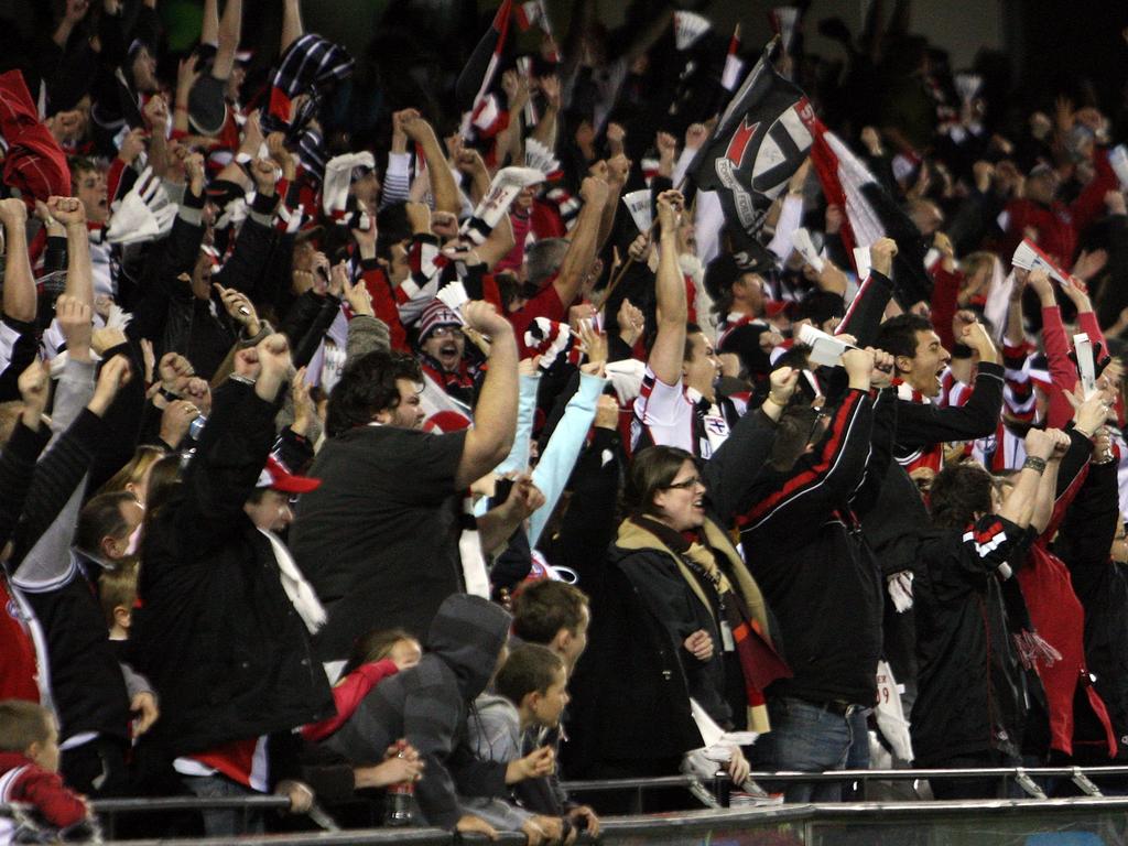 Saints fans celebrate the matchwinning goal in the classic against Geelong.