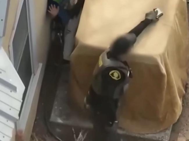 They can be seen hiding behind a unit while they attempt to evade capture. Picture: Bernalillo Sheriffs County Office