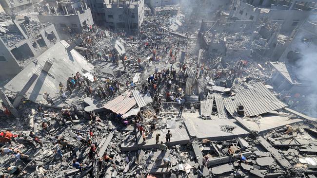 People search for survivors and the bodies of victims through the rubble of buildings destroyed during Israeli bombardment, in Khan Yunis on October 26, 2023. Picture: AFP