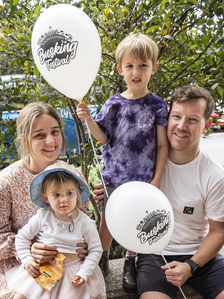 Candice and Jake McGrath with their kids June and Wally watch the performers of the Toowoomba Busking Festival, Saturday, April 29, 2023. Picture: Kevin Farmer