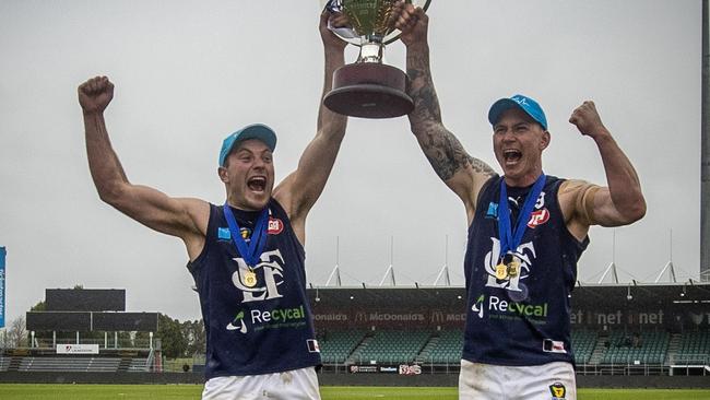 Launceston captain Jobi Harper and playing coach Mitch Thorp lift the premiership trophy. Picture: LUKE BOWDEN