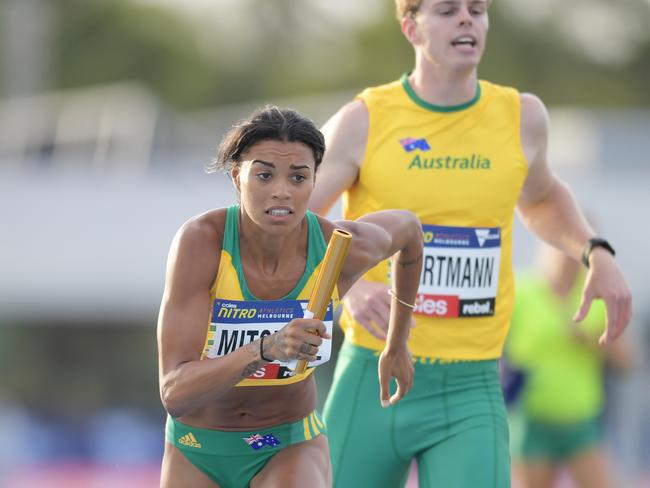 Australian athlete Morgan Mitchell takes the button from Alex Hartmann in the mixed 4x400 metre relay at the NITRO Athletics series round 2 at Lakeside Stadium in Melbourne, Australia, Thursday, Feb. 9, 2017. (AAP Image/Tracey Nearmy) NO ARCHIVING, EDITORIAL USE ONLY