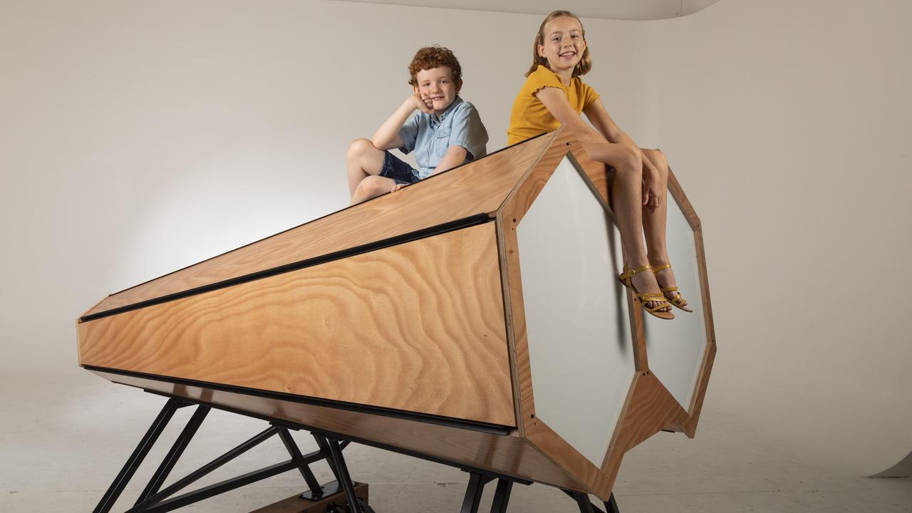 Rocco Stone, 8 and Vienna Stone, 9, with the Now You See Me giant binoculars display. Picture: Mark Cranitch