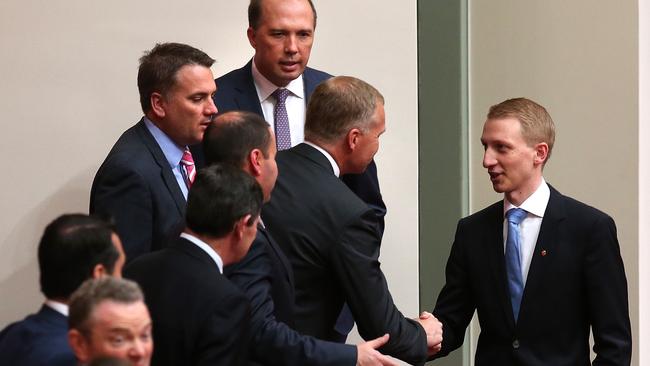 Speaker Tony Smith shakes hands Paterson after he delivered his maiden speech in the Senate Chamber.