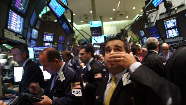 A trader on the floor of the New York Stock Exchange on September 15, 2008. In afternoon trading the Dow Jones Industrial Average fell over 500 points as US stocks suffered a steep loss. Picture: Spencer Platt/Getty Images