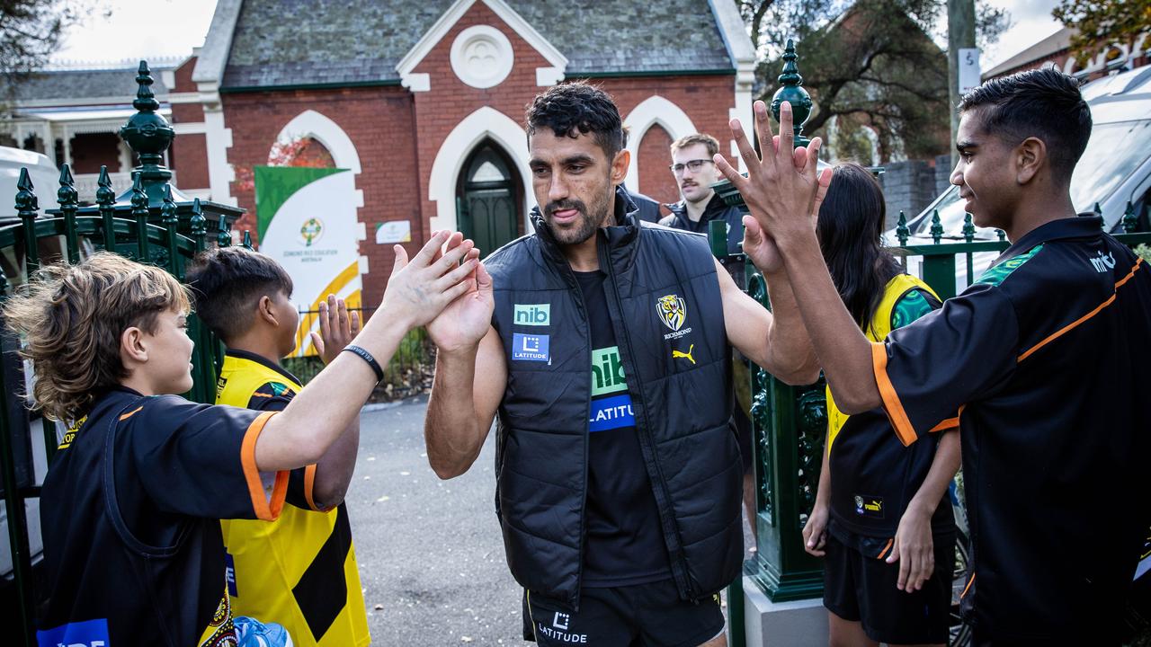 Richmond players visit the Indigenous Transition School Boarding House. Marlion Pickett is greeted by students upon arrival. Picture: Jake Nowakowski