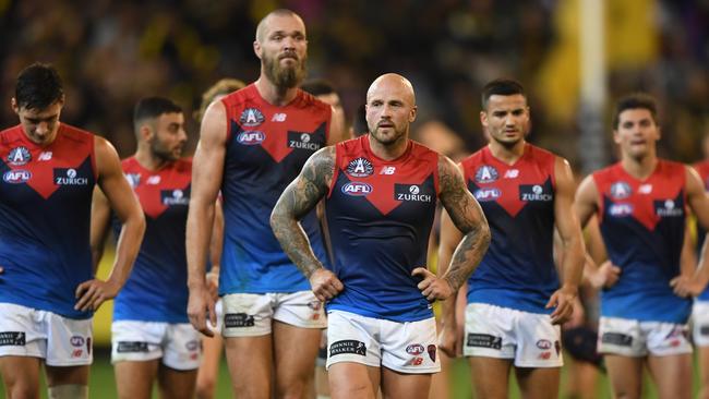 Nathan Jones (centre) leads the Demons from the ground after the Round 6 AFL match between the Richmond Tigers and the Melbourne Demons at the MCG in Melbourne, Wednesday, April 24, 2019. (AAP Image/Julian Smith) NO ARCHIVING, EDITORIAL USE ONLY