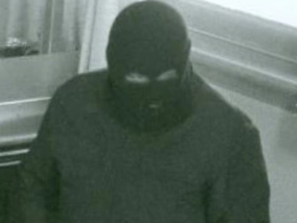 Kym Parsons wears his signature black balaclava during one of his robberies. Picture: Supplied