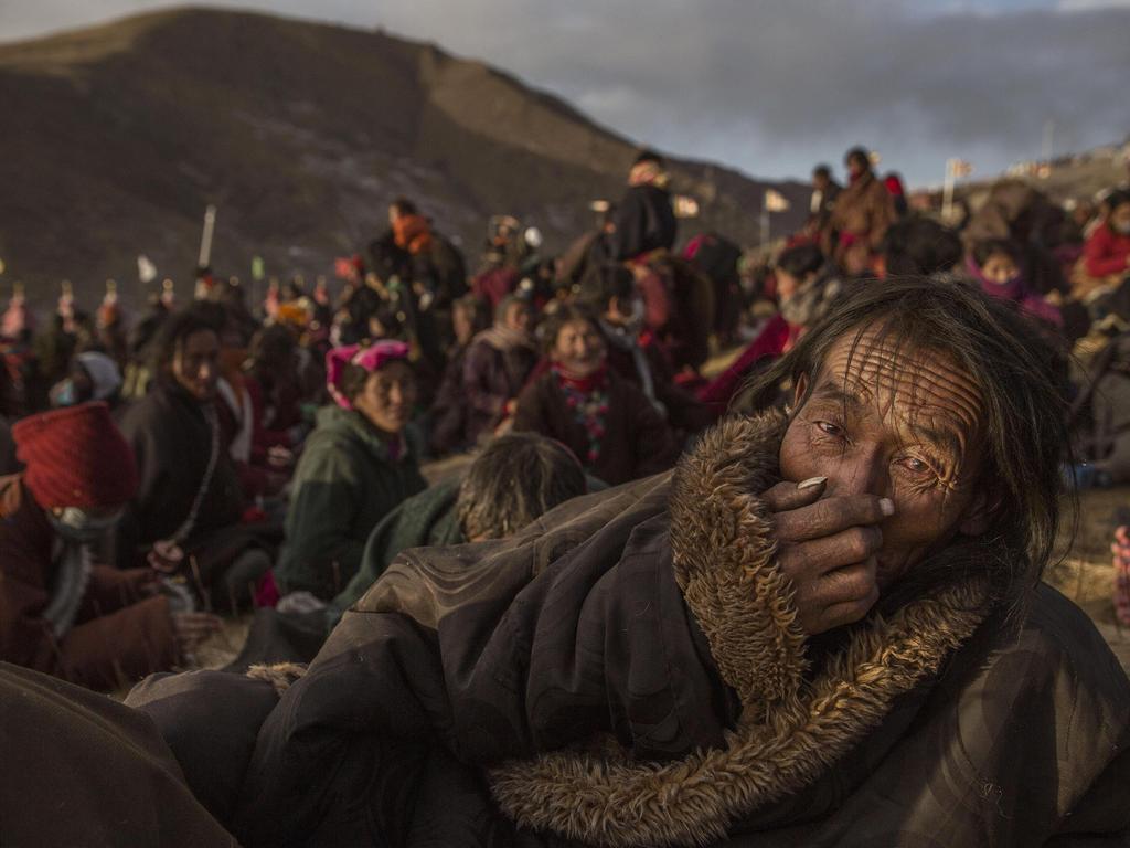 “Bliss Dharma Assembly” by photographer Kevin Frayer for Getty Images which won second prize in the Daily Life stories category shows Tibetan Buddhist nomads listening during the annual Bliss Dharma Assembly in Sertar county, Garze Tibetan Autonomous Prefecture, Sichuan province, China, Oct. 31, 2015. (Kevin Frayer/Getty Images, World Press Photo via AP)