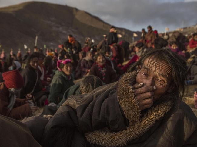“Bliss Dharma Assembly” by photographer Kevin Frayer for Getty Images which won second prize in the Daily Life stories category shows Tibetan Buddhist nomads listening during the annual Bliss Dharma Assembly in Sertar county, Garze Tibetan Autonomous Prefecture, Sichuan province, China, Oct. 31, 2015. (Kevin Frayer/Getty Images, World Press Photo via AP)