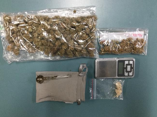 Drugs and cash seized in a raid into a Sippy Downs home by Sunshine Coast Police last night.