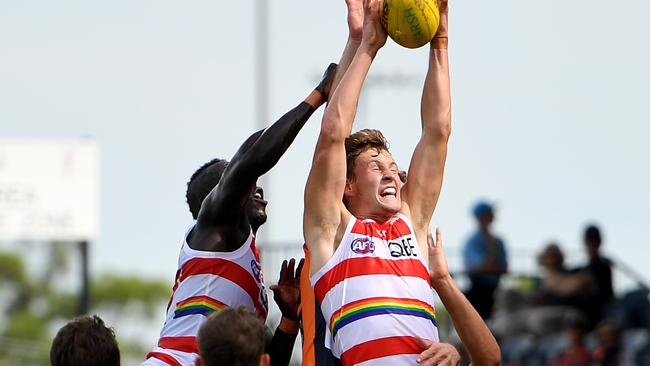 Jordan Dawson of the Swans flies for a mark.