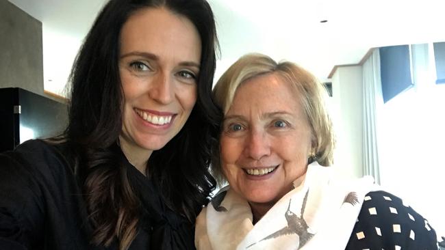 In this photo released by New Zealand Prime Minister Jacinda Ardern, former U.S. first lady Hillary Clinton, right, poses for a photo with Ardern during a breakfast meeting in Auckland, New Zealand, Monday, May 7, 2018. Clinton is on a two-day visit to New Zealand for a speaking engagement before traveling to Australia for further events. (Jacinda Ardern via AP)