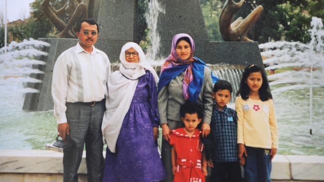 Hanif and Kamelah Rahimi, with Hanif's mother and their children Saleha at age 9, Mujtaba at age 7, and Freshta, aged 5, in front of the Victoria Square fountain.