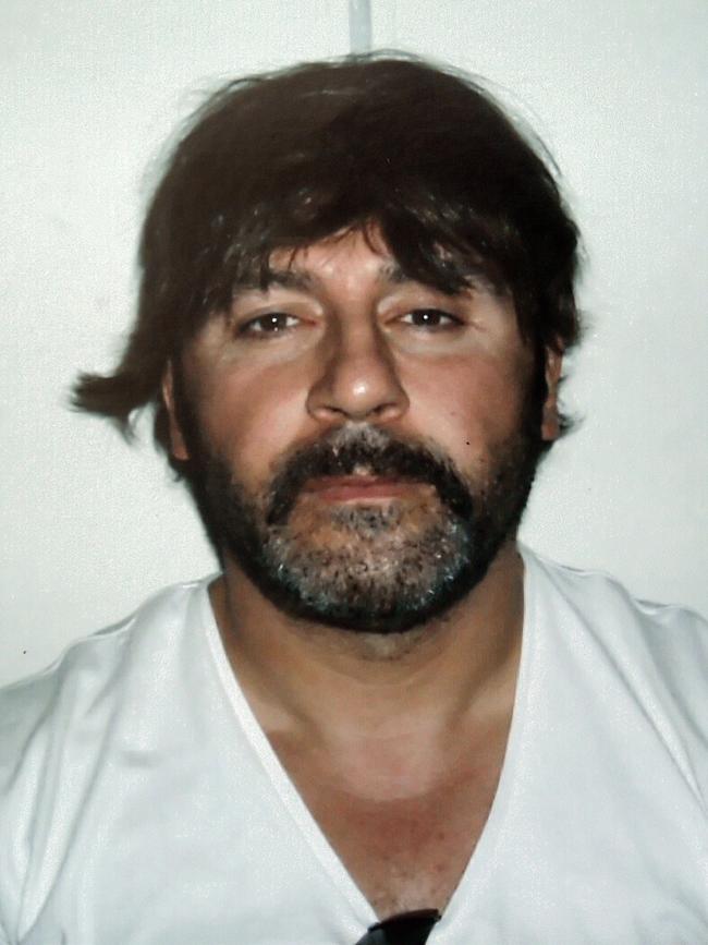 Tony Mokbel wearing the wig he was arrested in Greece in. He hopes the Lawyer X informer scandal will see him released.