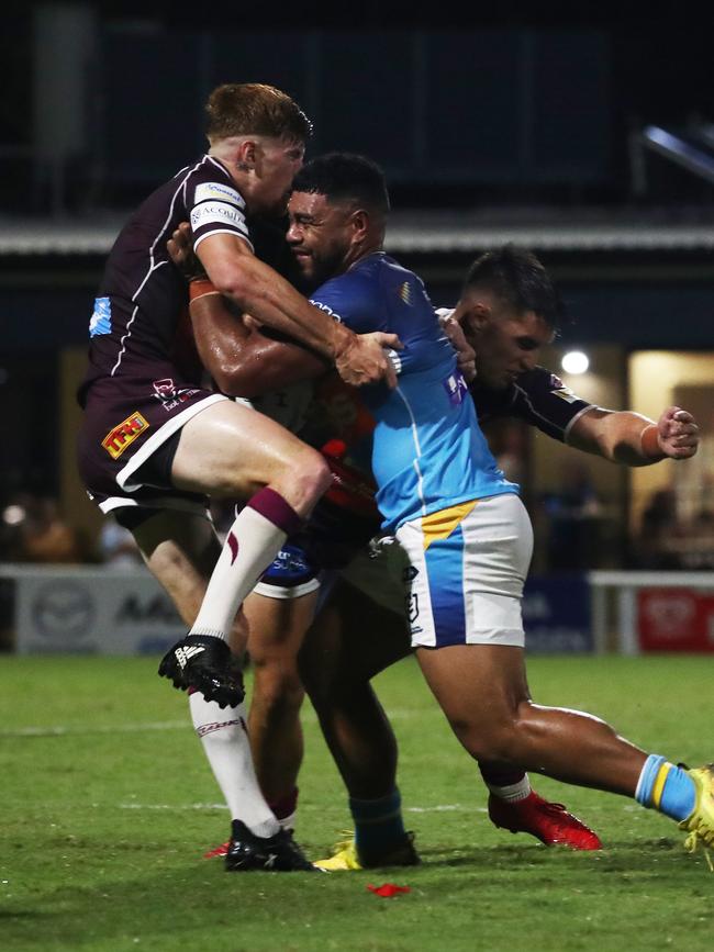Gold Coast Titans centre Greg Marzhew shrugs off a tackle from Burleigh Bears halfback Guy Hamilton during a pre-season trial at Pizzey Park. February 20, 2021. Photo Jason O'Brien