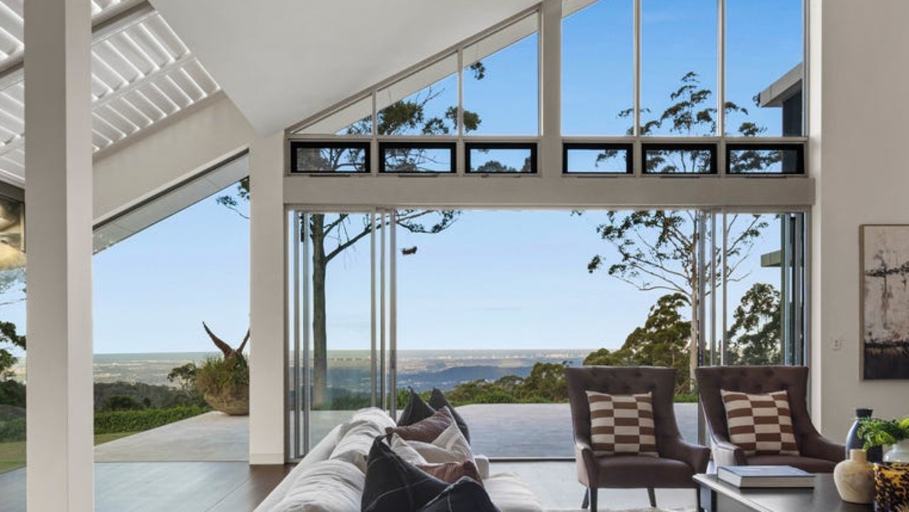 An A-frame design with expanses of glass captures stunning views