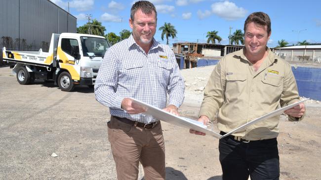 BM Webb Industrial Property sales manager Jeff Turner and operations manager Adam Beasley look at plans for a proposed showroom project in Woolcock St, Garbutt.