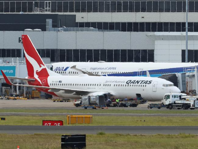 SYDNEY, AUSTRALIA - JANUARY 18: Qantas flight QF144 berths at a gate at Sydney Airport on January 18, 2023 in Sydney, Australia. Emergency services were on standby at Sydney Airport after Qantas flight QF144 from Auckland issued a mayday call on Wednesday afternoon. (Photo by Brendon Thorne/Getty Images)