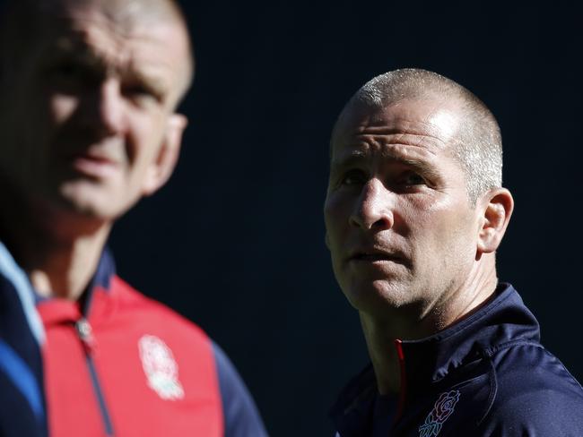 England's head coach Stuart Lancaster (C) and forwards coach Graham Rowntree look on during the Captain's Run training session at Twickenham Stadium, south west London on September 25, 2015. England play Wales tomorrow in their second Rugby World Cup Pool A match. AFP PHOTO / ADRIAN DENNIS RESTRICTED TO EDITORIAL USE