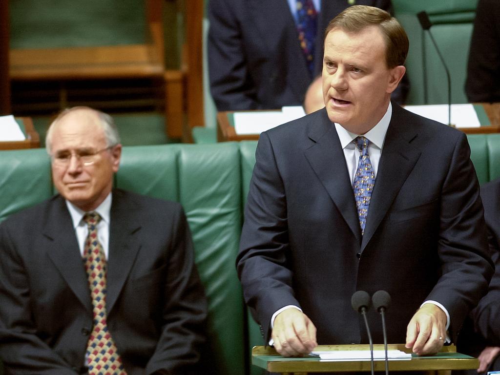 Former Treasurer Peter Costello, right, once called inflation a “dragon that must be slayed”. Former Prime Minister John Howard is seated to his left as Mr Costello delivered the Budget in May 2001. Picture: National Archives of Australia