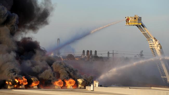 Crews trying to bring the inferno under control. Picture: Andrew Henshaw