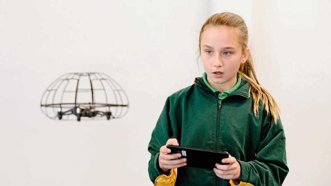 Ava Clark was a picture of concentration as she flew the drone. Picture: USQ Photographer: Anna Singleton