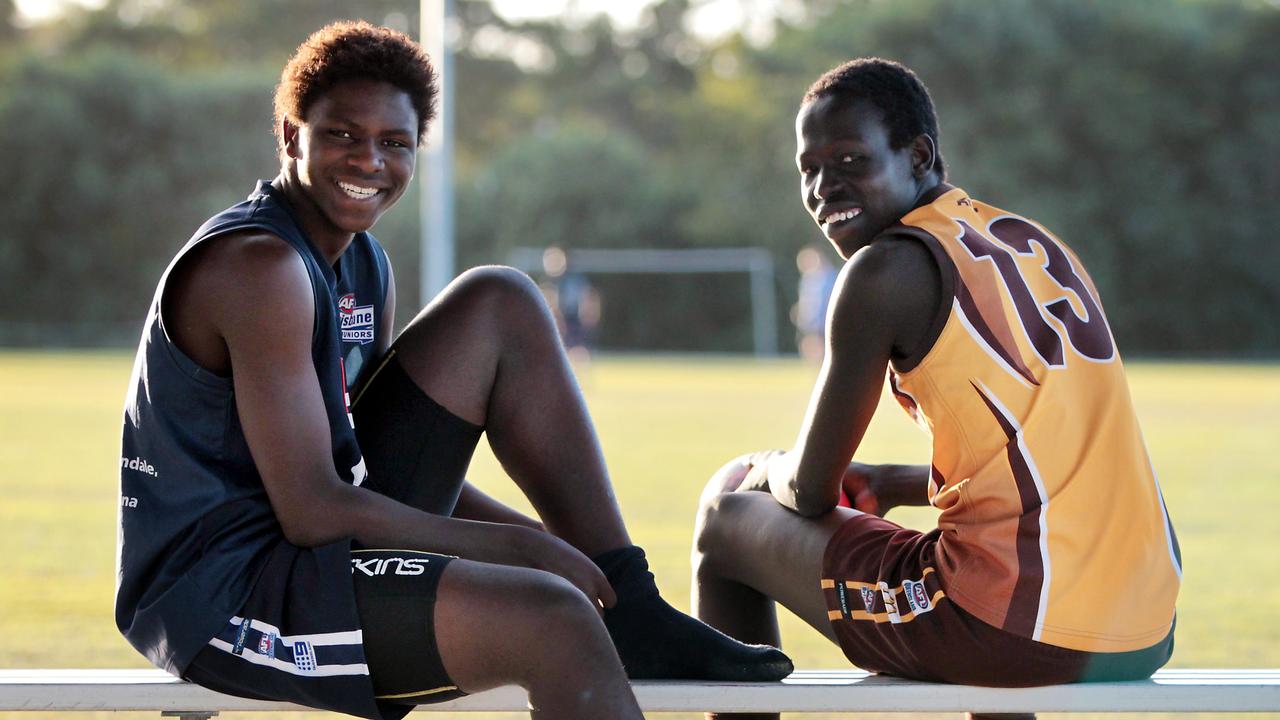 Aliir Aliir (right) as a budding junior footballer ahead of the Australian under-16 championships.