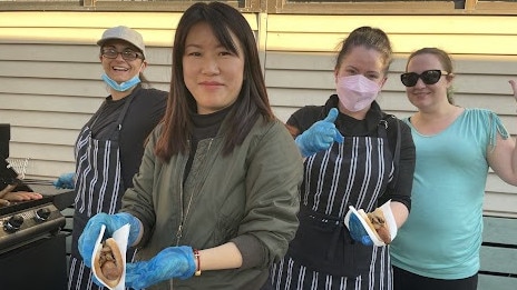 Joanna Forbes, Mila Jin, Anne Anstee and Eileen Forbes have gone through more 50kg of sausages for hungry voters at Pinewood Primary School in Mt Waverley in the seat of Chisholm during the 2022 federal election on May 21. Picture: Kiel Egging.