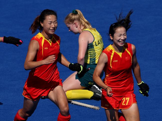 PARIS, FRANCE - AUGUST 05: Team People's Republic of China celebrate a victory following the Quarter Final Women's match between Australia and People's Republic of China on day ten of the Olympic Games Paris 2024 at Stade Yves Du Manoir on August 05, 2024 in Paris, France. (Photo by Clive Brunskill/Getty Images)