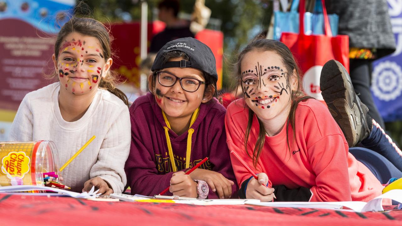 Colouring in at the USQ stall are (from left) Annabell Washington, Makka Stanton and Aaliyah Washington at the NAIDOC Community Day at Queens Park, Monday, July 5, 2021. Picture: Kevin Farmer