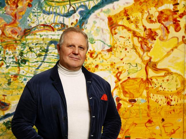 Tim Olsen in the Olsen Gallery in Woollahra in front of the work Holiday by the Sea his father John Olsen. Picture: John Appleyard