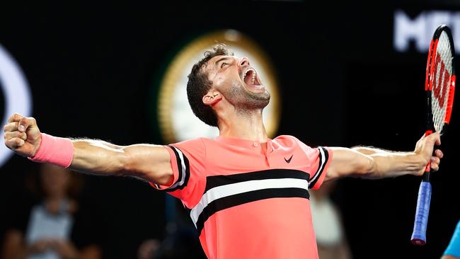 Grigor Dimitrov of Bulgaria celebrates his victory over Nick Kyrgios on Sunday night. Photo: Getty Images